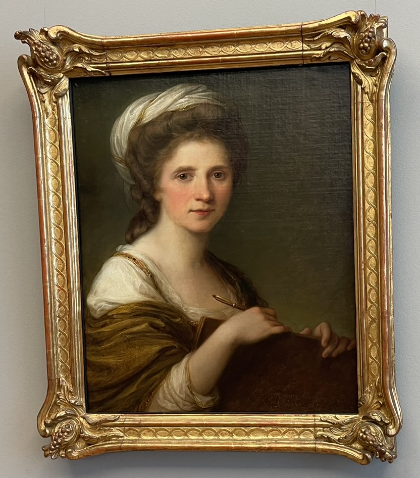 Self-portrait by Angelika Kauffmann with long hair wearing a white headscarf and a brown robe, holding a sketchbook and a pencil, set in a gilded frame.