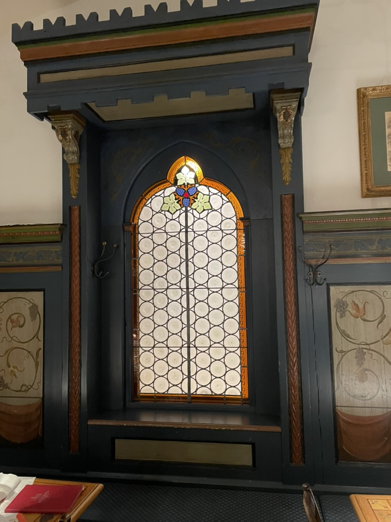 Decorative stained glass faux window at the restaurant Ratskeller in Munich, featuring intricate designs and colors.